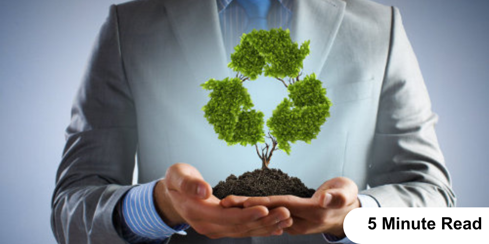 A man holding a small tree